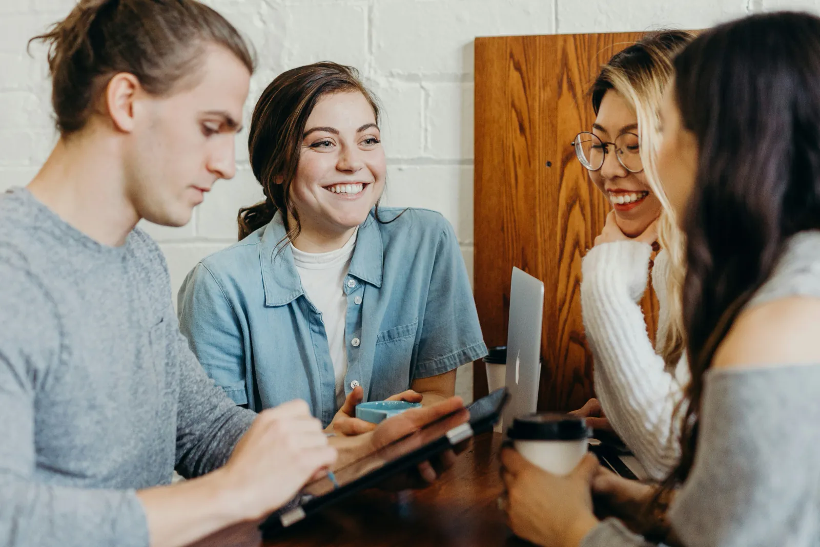 Young adults collaborating around a table